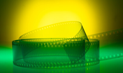 yellow-green background with film strip