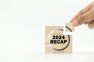 RECAP word icon on wooden cubes on white background and copy space. 2024 Recap economy, business, financial concept. For business planning. 