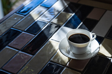Cup of hot coffee on a table,