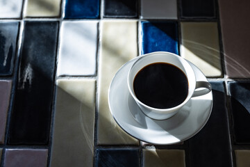 Cup of hot coffee on a table,