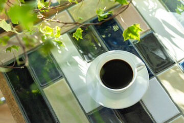 Cup of hot coffee on a table,