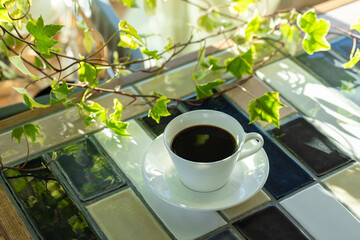 Cup of hot coffee on a table,