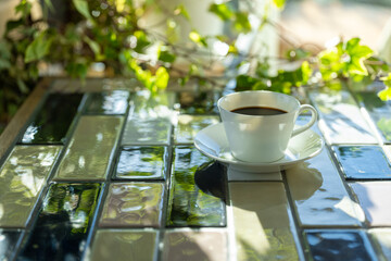 Cup of hot coffee on a table