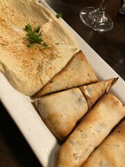 Lebanese meat stuffed pitas with hummus 