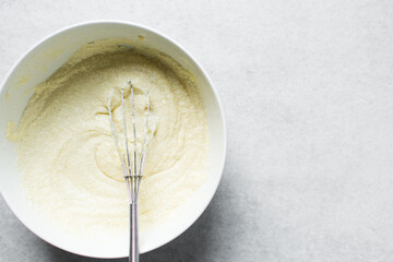 Creaming butter and sugar with a whisk, the process of making cake, mixing butter and sugar to make a cake