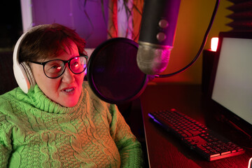 The Pensioner Female Is Having A Conversation And Recording A Podcast Live On Social Media. A...