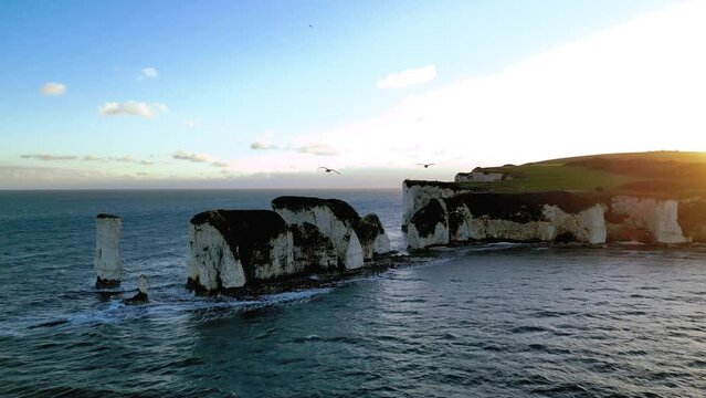Aerial Drone View of Old Harry Rocks at sunset. View of Studland Bay, Handfast point of the Dorset coastline in England
