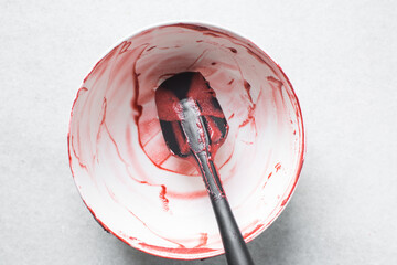 Red velvet cake batter in a bowl that has been scraped clean, Leftover cake batter