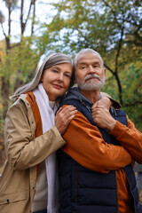 Portrait of affectionate senior couple in autumn park