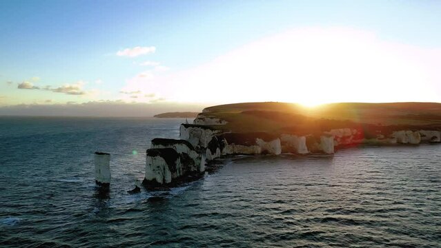 Aerial drone video of Old Harry Rocks at sunset. View of Studland Bay, Handfast point of the Dorset coastline in southwest England