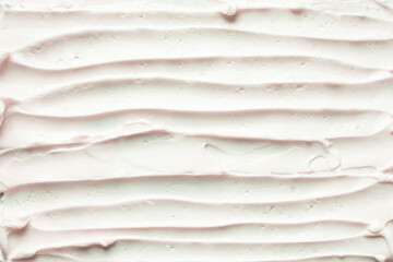 Top view of pink buttercream for decorating cake, silky smooth american buttercream on a marble surface, overhead view of smooth buttercream