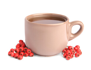 Aromatic hawthorn tea in cup and berries isolated on white