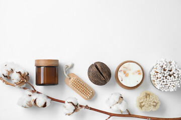 Bath accessories. Flat lay composition with personal care products and cotton flowers on white background, space for text