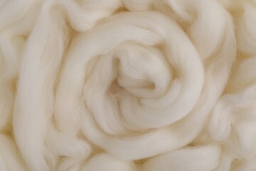 White felting wool as background, closeup view