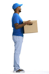 A male deliveryman with a box, on a white background, full-length, in profile