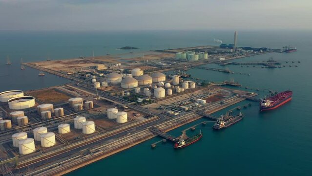 Aerial Top View oil tanker loading dock of business logistic sea going ship, Oil tanker lpg ngv at night / Group Oil tanker to Port of Singapore - Cargo ship import export	