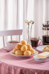 Boho Breakfast table. Typical Brazilian breakfast. Pão de Queijo. Black Coffee. Butter toast. Granola.