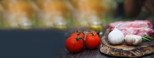 Banner Raw meat beef steak organic fresh ingredient on wooden board table background in kitchen with rosemary, salt, garlic, tomato, olive oil. Meat beef on wooden plate for beefsteak with copy space