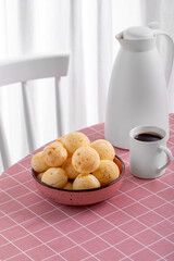 Boho Breakfast table. Typical Brazilian breakfast. Pão de Queijo. Black Coffee. Butter toast. Granola.