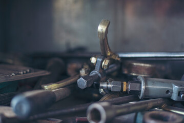 Mechanic tools engineering equipment car auto repair shop with copy space. Blurred background mechanical service. Heavy screw grungy rusted wrenches dirty screwdriver object. Industrial hardware set