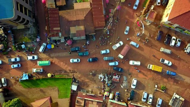 Cars In Traffic Jam On Road Junction In Kampala City, Uganda. aerial topdown shot