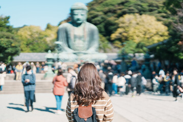 Woman tourist Visiting in Kamakura, Kanagawa, Japan. happy Traveler sightseeing the Great Buddha...