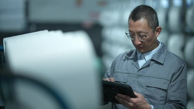 people using tablet in chemical fiber plant