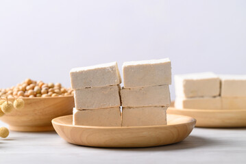 Fresh tofu in wooden bowl, Vegan food ingredient in Asian cuisine, Plant based diet