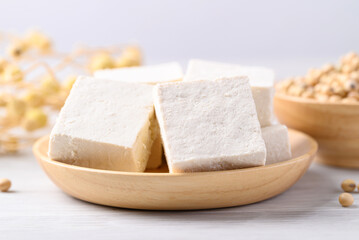 Fresh tofu in wooden bowl, Vegan food ingredient in Asian cuisine, Plant based diet