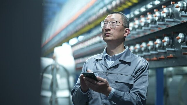 people using mobile phone in chemical fiber plant
