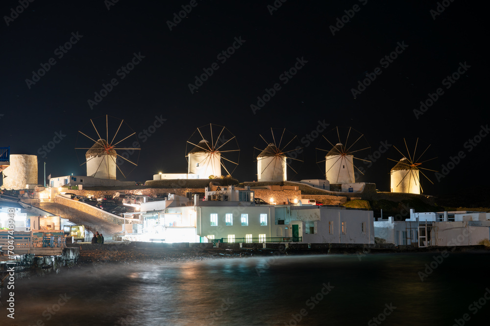 Sticker windmills of mykonos island at night. greece