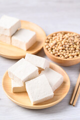 Fresh tofu in wooden bowl, Vegan food ingredient in Asian cuisine, Plant based diet
