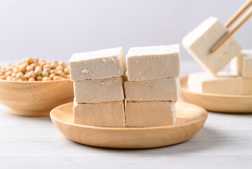 Fresh tofu in wooden bowl, Vegan food ingredient in Asian cuisine, Plant based diet