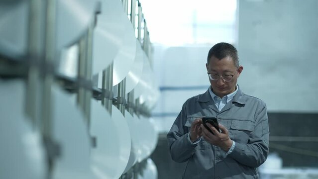 people using mobile phone in chemical fiber plant