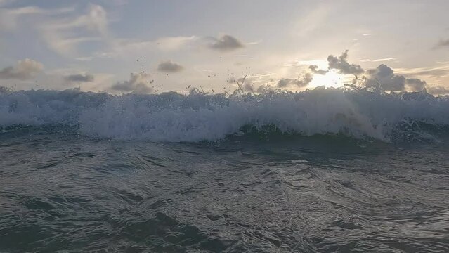 Slow motion under the ocean wave water.