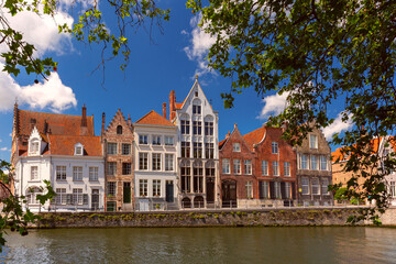 Fototapeta na wymiar Sunny Bruges canal Spiegelrei with beautiful medieval houses, Belgium