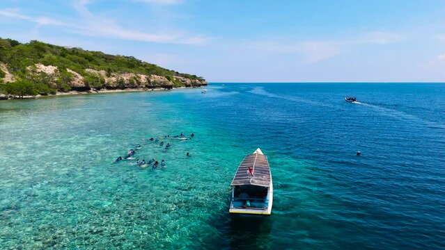 beautiful beach island boat on the blue ocean snorkling sport water activity