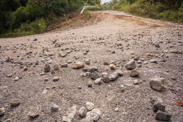 Bad country road. The asphalt road is full of holes and cracks