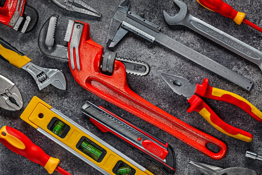 Construction Tools On Dark Background Composed In Diagonal Of Image.