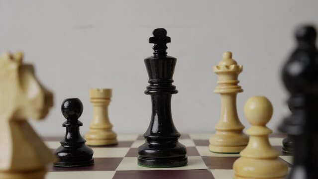 Arrangement of Chess pieces as players strategically move across board