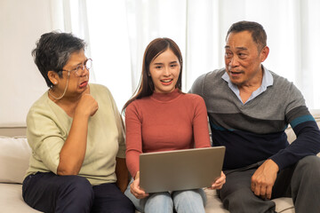 Portrait enjoy happy smiling love asian family.Senior mature father hug with elderly mother and young adult woman play laughing and having fun together at home.insurance concept