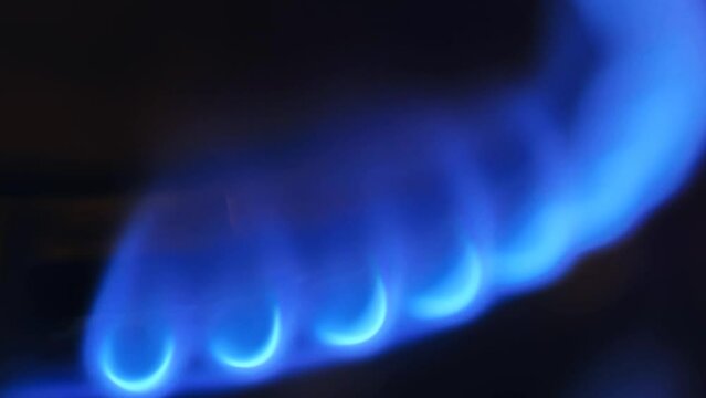 Gas background . Gas burner and blue flame close-up. gas savings. 4k footage