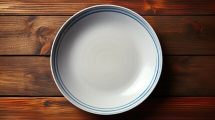 top down view A empty plate on a wooden table - obrazy, fototapety, plakaty