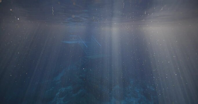 View of sunlight ripples in natural spring water at Devil's Den Prehistoric Spring