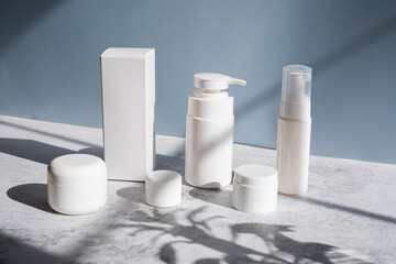 Mockup cosmetic packaging on light blue background for beauty and skincare concept.