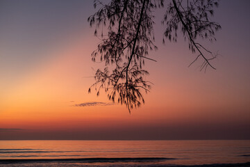 Fototapeta na wymiar Morning seaside with twilight light. Ocean waves.