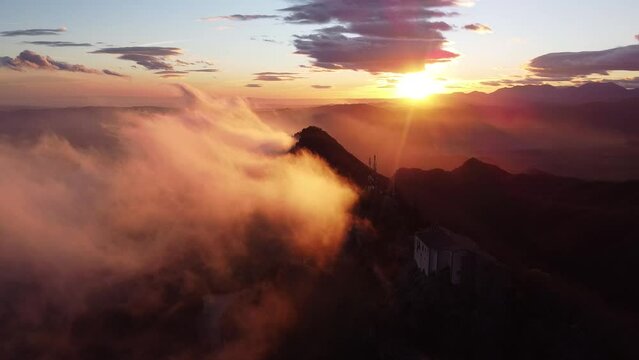 Drone shot orbiting Santuari de Bellmunt in Catalonia sunset. Church on mountain in Spain