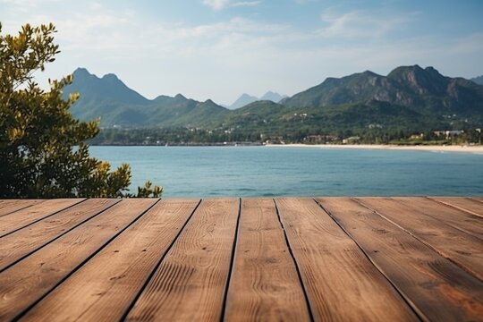 Wooden dock with blurred background of mountains and sea © duyina1990