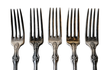 four identical tarnished silver forks