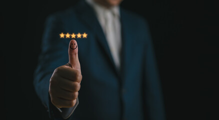 Customer satisfaction concept. Hand with thumb up Positive emotion smiley face icon and five star with copy space. Customer review.